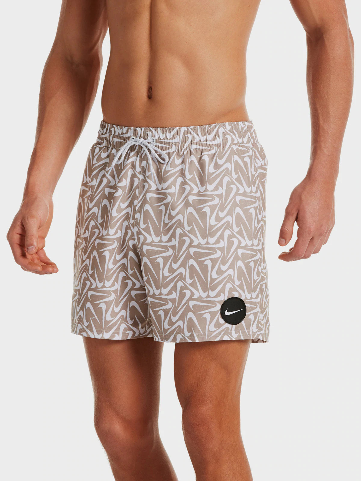 NIKE DRI-FIT SWIMSUIT SHORT WITH A MULTI-LOGO PRINT